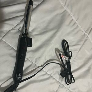 Medium size curling iron never been use